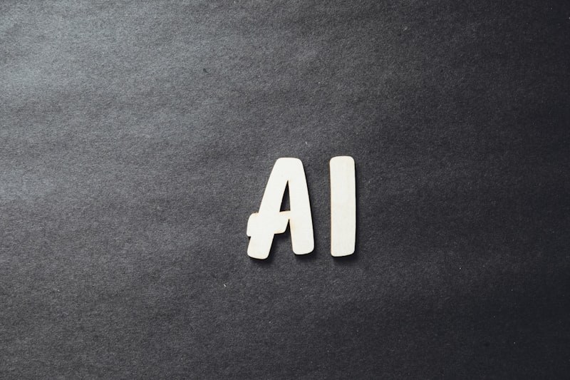 Letras AI em madeira sobre superfície escura